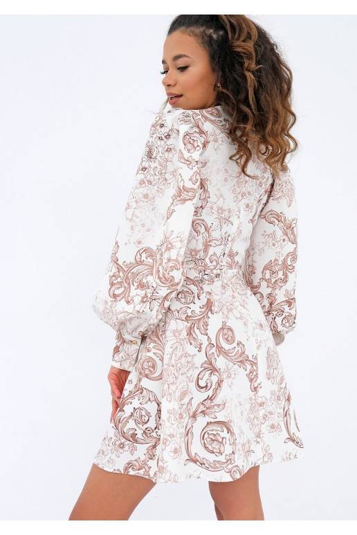 Kleita ar pūstām piedurknēm ar rakstiem bēšā krāsā